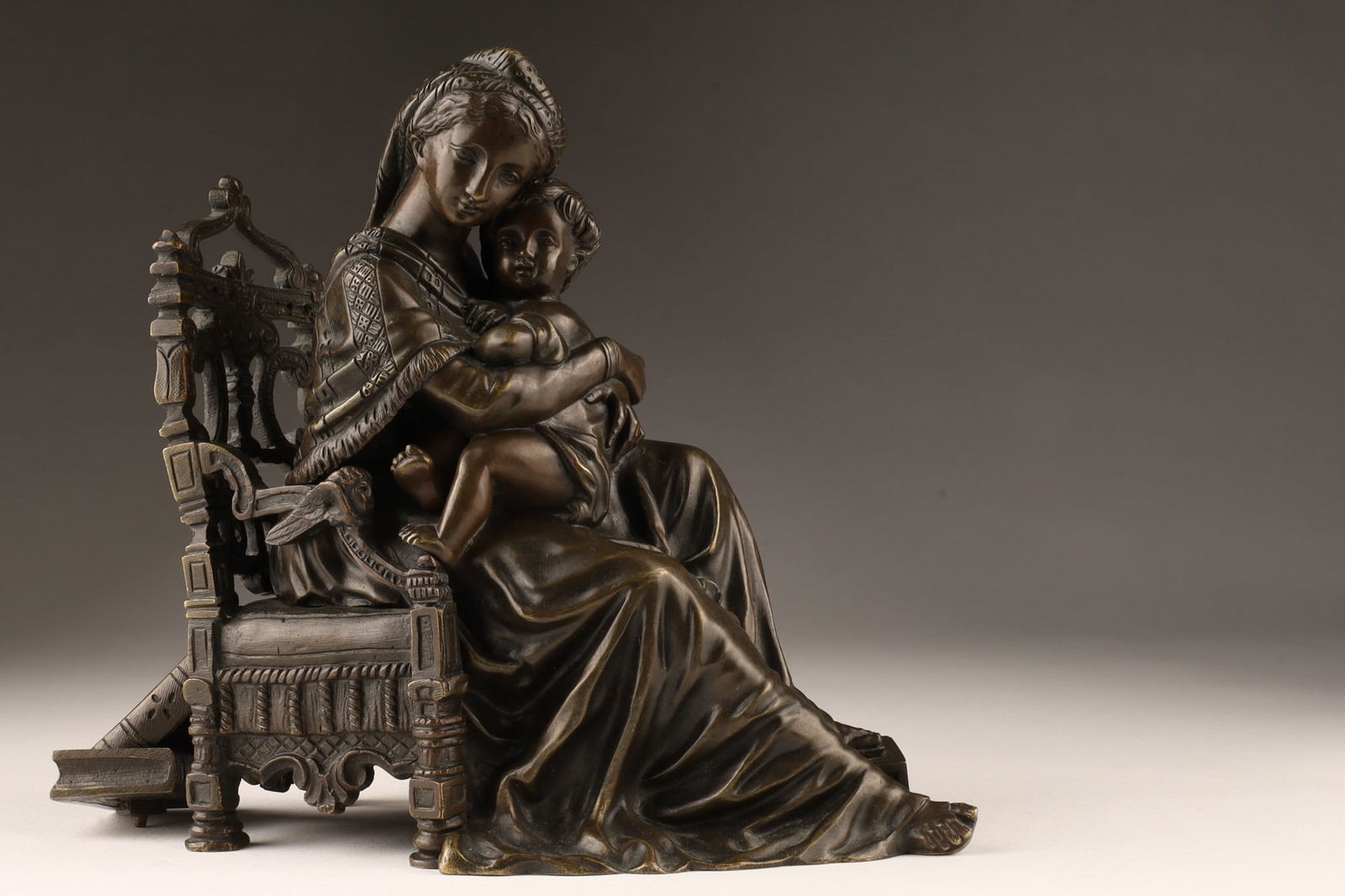 Italian Antique Bronze Virgin of Chair Sculpture: After Raphael (Italy, 1483 - 1520), antique bronze figure titled Virgin of the Chair after painting by Raphael, circa 19th century. 6.5 inches H x 7 L x 3 deep.