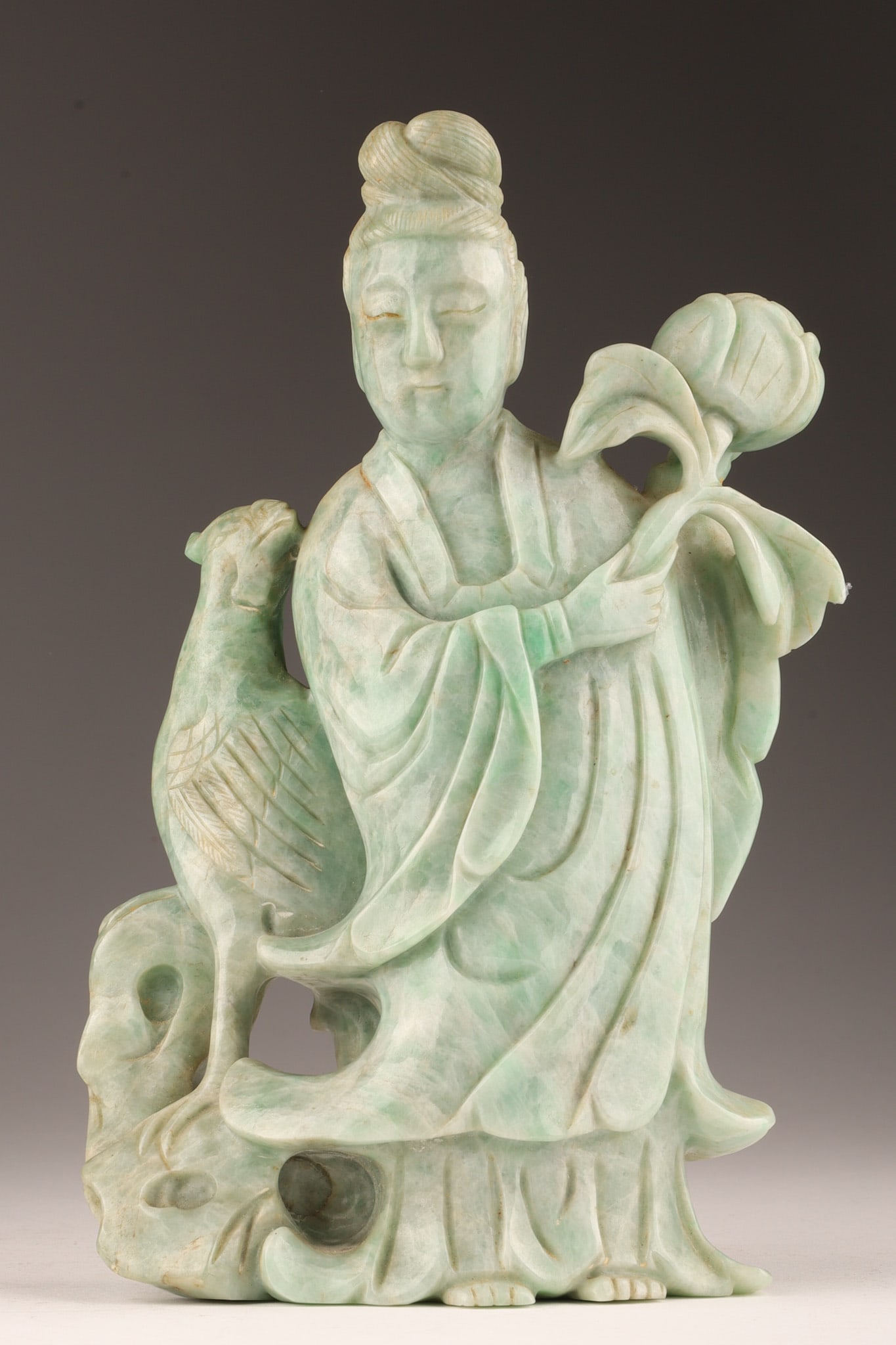 Antique Chinese Mottled Green Jade Guanyin Phoenix: Antique Chinese Mottled Green Jade Guanyin with Phoenix and Peony Branch. Measures 8 inches H x 5 W x 2 deep.
