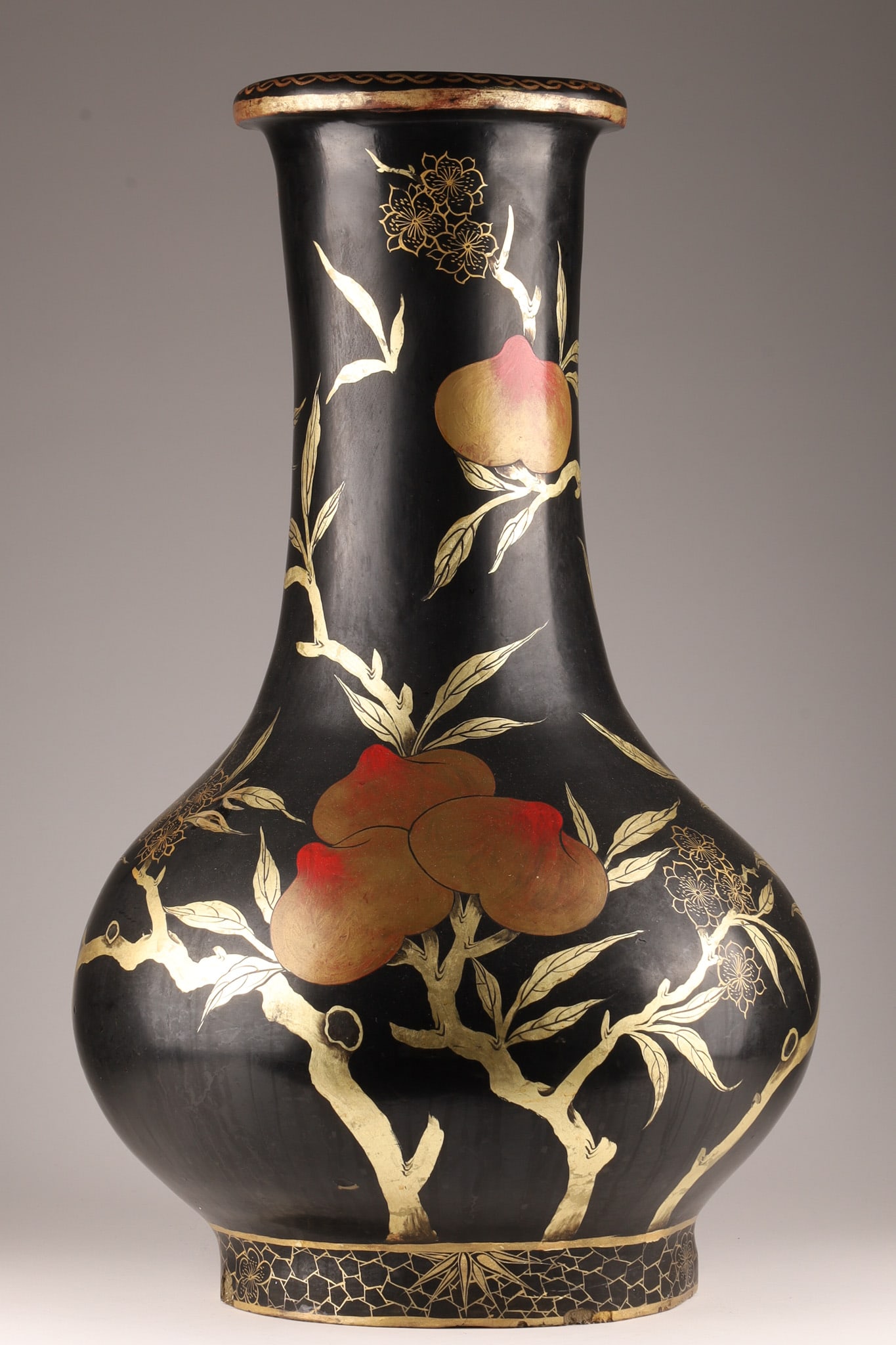 Antique Chinese Japanese Papier Mache Peach Vase: Chinese or Japanese very large oversized antique black laquered papier mache vase with hand painted peach motif with gold highlights, circa 19th century. 27 inches H x 14 W.