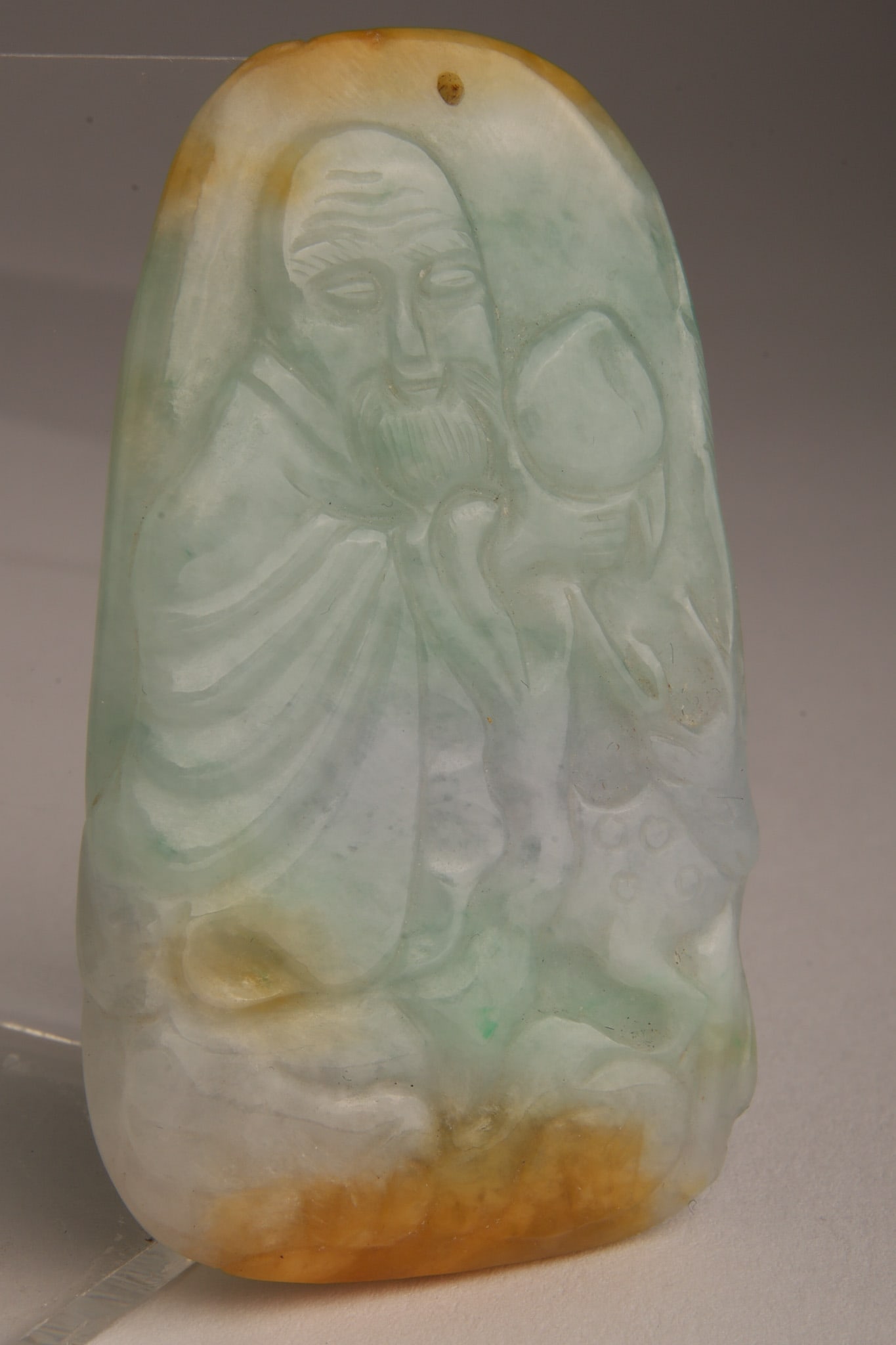 Chinese Tricolour Jadeite Pendant: Chinese Tricolour Jadeite Pendant. Carved on both sides, depicting wise old men. 2.5 inches H.