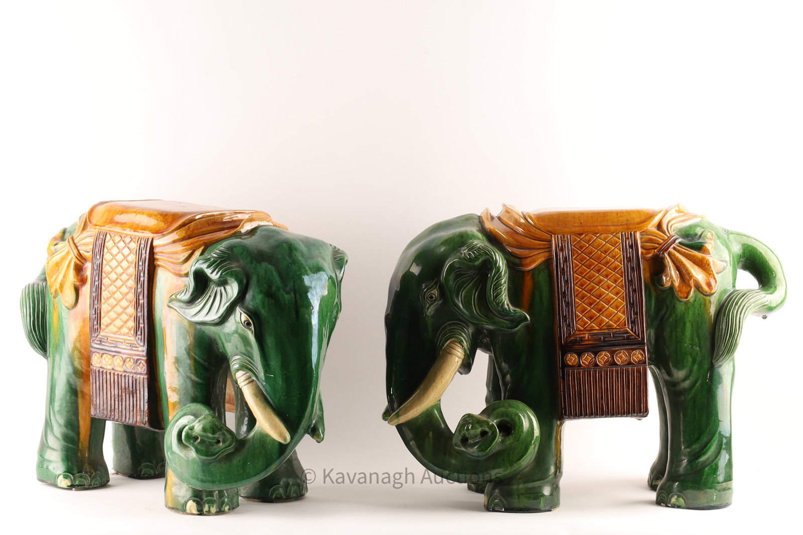 Antique Chinese Terracotta Elephants Garden Seats: Pair Antique Chinese green and brown glazed terracotta Elephants Garden Seats. Small chips on one. Measuring H 22 x W 26 x D 10.