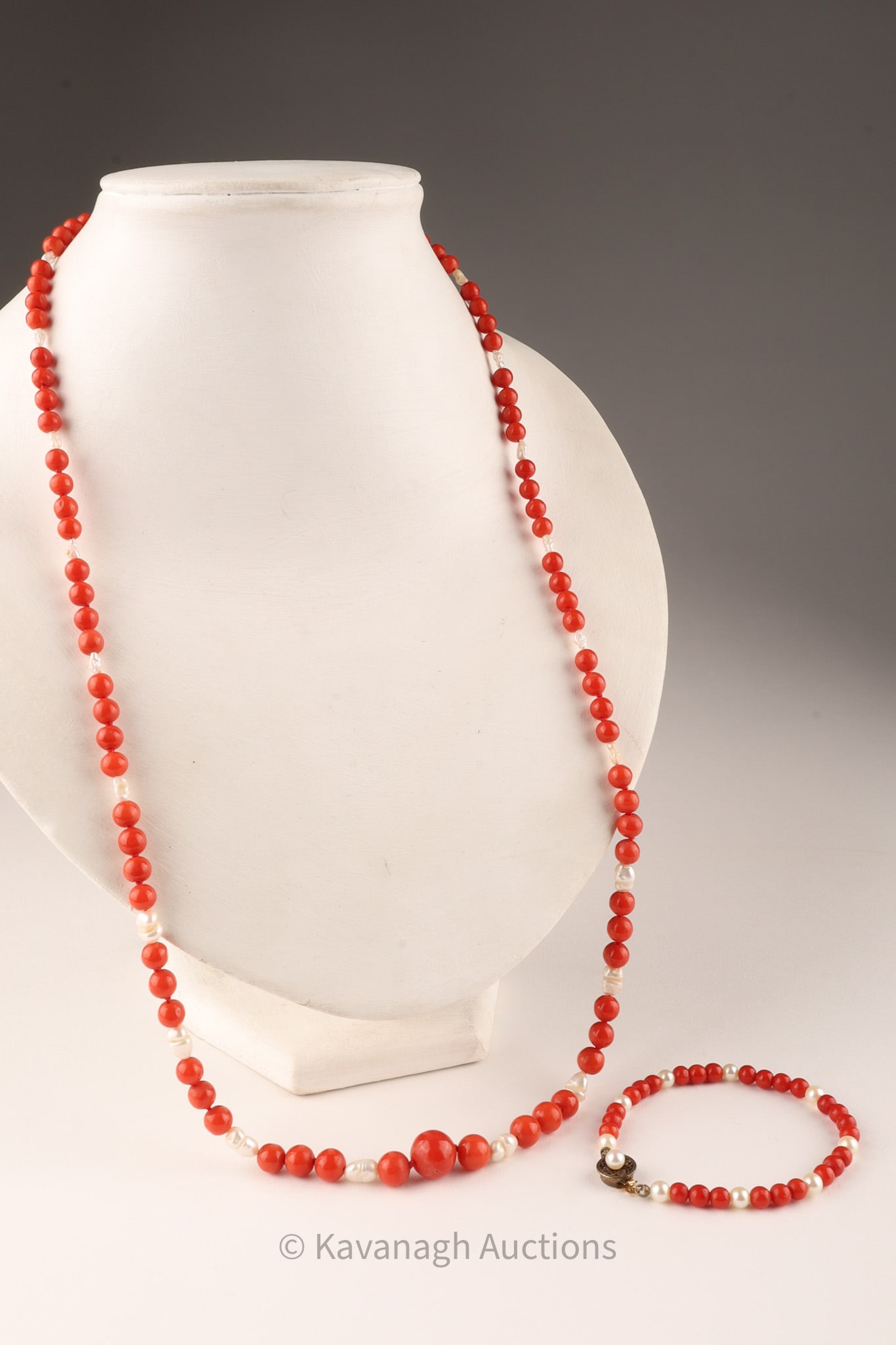 Red Coral Beads and Pearls Necklace and Bracelet: Red Coral Graduated Beads and Pearls Necklace and Bracelet. Necklace measures 28 inches L, bracelet measures 7 inches.