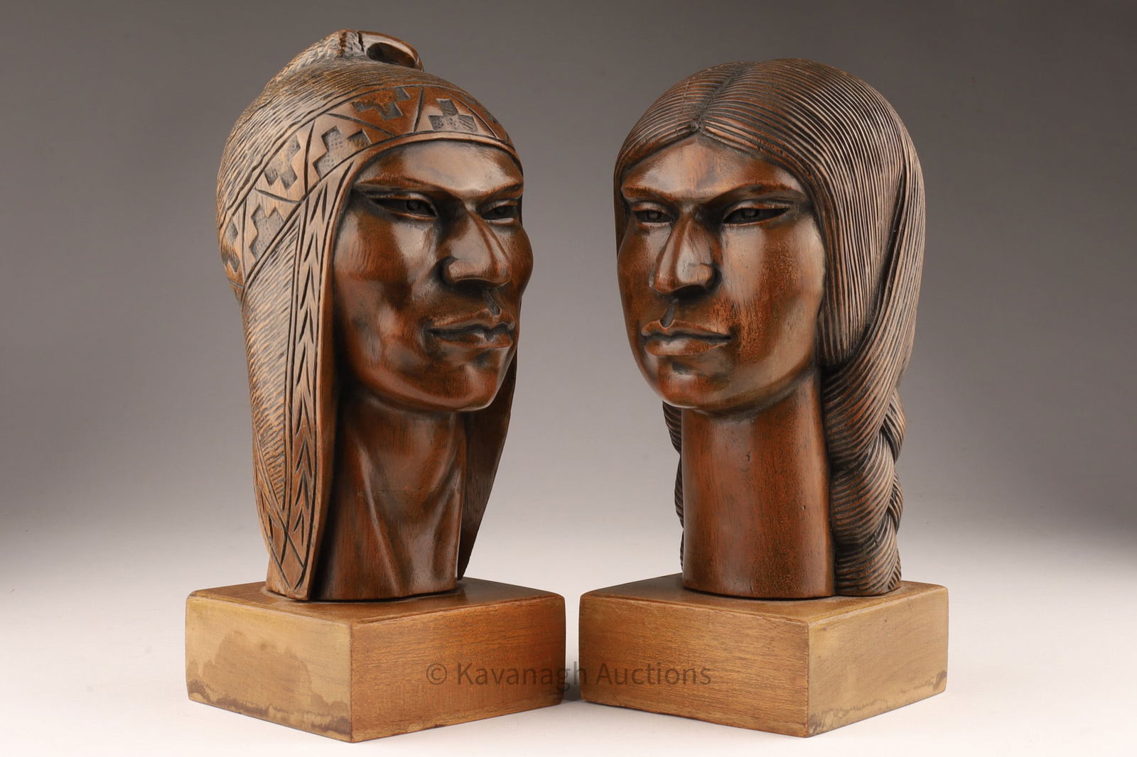 A. Gutierrez Carved Bust Sculptures Bolivia: A. Gutierrez Wood Carved Male and Female Bust Sculptures Bolivia. Signed on base, 8 inches H x 3.5 W x 3.5 deep.