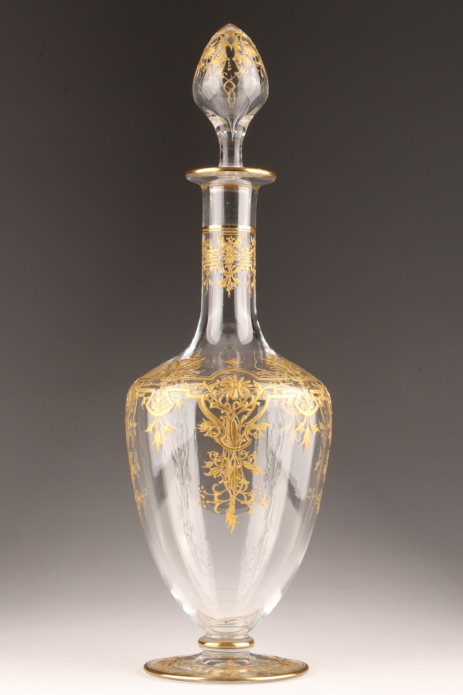 Antique Gilded Crystal Decanter Baccarat or Moser: Antique Gilded Crystal Decanter / Baccarat or Moser. Decorated with finely enameled gold flowers in a secessionist frame. Unmarked. 13.5 inches H with stopper.