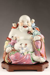 Large Chinese Famille Rose Buddha Budai and Boys: Large Chinese Famille Rose Porcelain Figural Group Buddha Budai and Boys on octagonal footed hardwood tray. Figure measures 12 inches H x 12 W x 7 deep. Some loss to enamel.