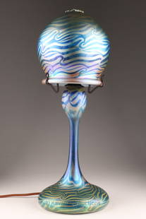 Phoenix Studios Carl Radke King Tut Glass Lamp: Phoenix Studios Carl Radke art glass table lamp. Features iridescent blue and gold domed closed shade and body with a blue and gold King Tut pattern on closed base. Etched mark Carl Radke 78 Phoenix