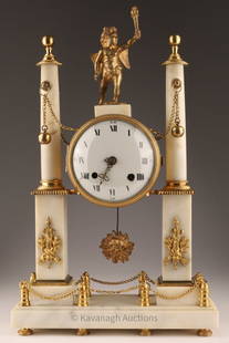 Antique French Marble Louis XVI Portico Clock: Antique French Marble Louis XVI Portico Clock decorated with a cherub, gilt bronze trim, porcelain enameled dial. Some chipping near key hole, one hand has broken off, clock requires servicing. 17 inc