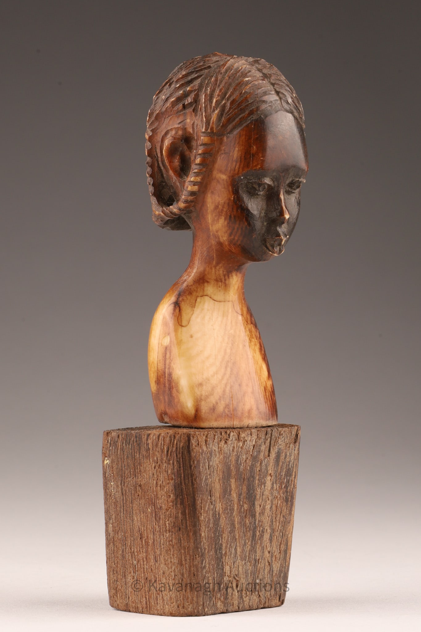 Small African Carved Bust of a Female with Braids: Small African Carved Bust of a Female with Braids. 3 inches H, 4.5 inches H with base. THIS ITEM CANNOT BE EXPORTED FROM CANADA.