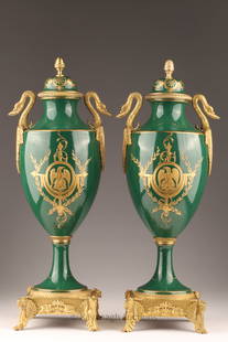 Pair 19th C Sevres Gilt Mounted Urns Napoleon: Pair of 19th Century Sevres Style Porcelain Gilt-Metal Mounted Urns, each with central painted panel signed lower right, depicting scenes from the coronation of Napoleon; one depicting a crowd with fi