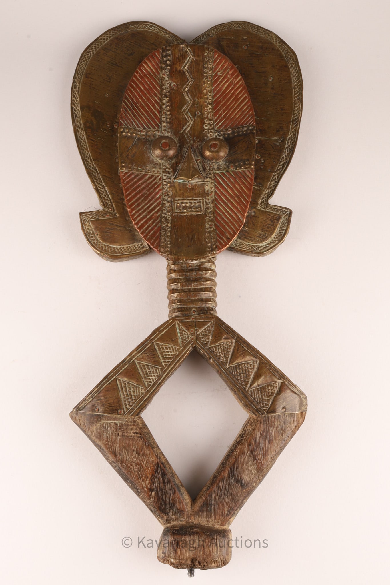 African Gabon Osseyba Reliquary Kota Sculpture: African Gabon Osseyba Reliquary Kota Sculpture made of wood with sheet metal fittings, depicting a deconstructed female figure with a wide robe of hair on an open, diamond-shaped body. 21 inches H x 9