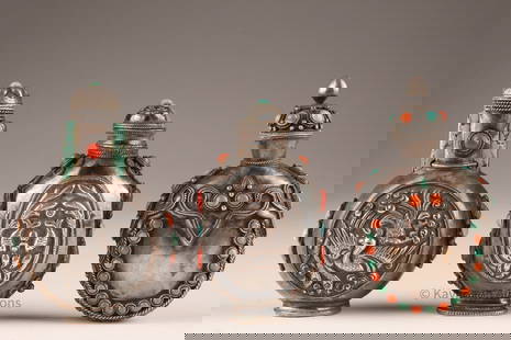Lot Chinese or Mongolian Silver Snuff Bottles: Lot of 3 Chinese or Mongolian Silver Snuff Bottles inlaid with turquoise and red stone, repousse decoration of fish and phoenix on two. 200 grams total weight. 3.5 inches H x 2.25 W. Bottle with fish