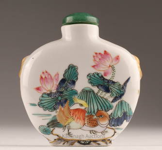 Chinese Famille Rose Porcelain Snuff Bottle Lotus: Chinese Famille Rose Porcelain Snuff Bottle with a scene of a lotus pond, featuring ducks and lotus flowers Signed on underside with jade stopper. 2.25 inches H x 2 W.