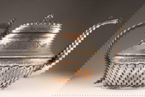 Antique Middle Eastern Silver Plated Copper Teapot: Antique Middle Eastern Silver Plated Copper Teapot. Hand hammered with script along the body, decorative gadrooning around the base and lid. 15 inches L x 8 H x 6 W.