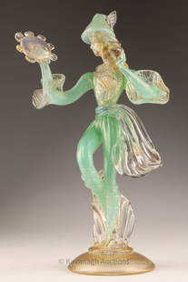 Murano Gold Flecked Venetian Glass Figure: Murano Sea Foam Green and Gold Flecked Venetian Glass Figure of a musician. With old paper label marked Pauly and C. Chips to hat feather. 10 inches H x 6 W.