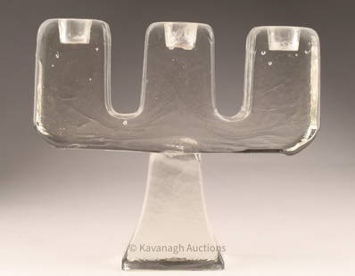 Swedish MCM Art Glass Candlestick Holder Pukeberg: Swedish MCM Art Glass Three Arm Candlestick Holder by Pukeberg. 6 inches H x 6.75 W x 2 deep. Small chips / flea bites to base.