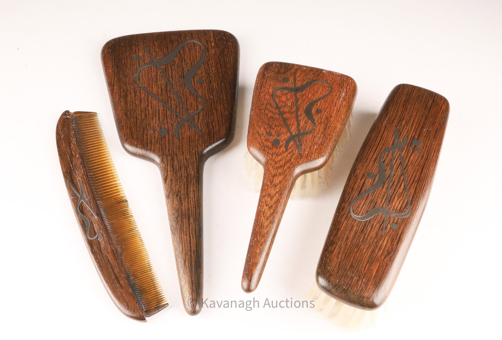 MCM Danish Andersen and Sohoel 4 Pc Vanity Set: Mid Century Modernist Andersen and Sohoel Denmark Hardwood 4 Pc Vanity Set inlaid with Sterling Silver. Reparation to comb teeth on one end. Mirror measures 10 inches L x 4.5 W.