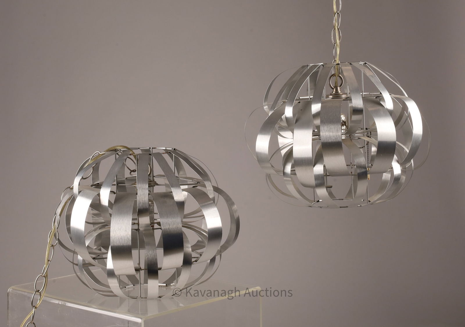 Pair Max Sauze Style Metal Ribbon Hanging Lights: Pair of Modernist Max Sauze Style Metal Woven Ribbon Pumpkin Hanging Lights. Lights measure 12 inches H x 16 diameter, long chains.