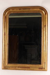 Louis Philippe French Giltwood Pier Mirror: Period Louis Philippe French giltwood pier mirror with curved upper rim, c.1840. 40 inches H x 28 W.