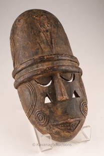 African Burkina Faso Carved Ritual Mask: African Burkina Faso Carved Ritual Mask decorated with carved geometric patterns, concentric circles. 13 inches L x 7 W x 3 deep.