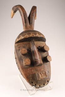 African Grebo Maou Four Eye Warrior Antelope Mask: African Grebo Maou Four Eye Warrior Mask with antelope horns. 17 inches L x 7 W x 5 deep.