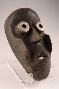 African Dan Mask Guinea Coast, Liberia Mano People: African Dan Face Mask Guinea Coast, Liberia, Mano People. A wooden and metal face mask originating from the Mano people of Liberia, Guinea Coast. 10 inches L x 6 W x 3.5 deep.
