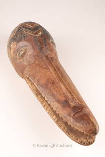 African Suaga Helmet Mask from Cameroon: African Suaga Helmet Mask from Cameroon, zoomorphic resembling a crocodile, are associated with the Mambila people of Cameroon. 17 inches L x 5 deep x 6 W.