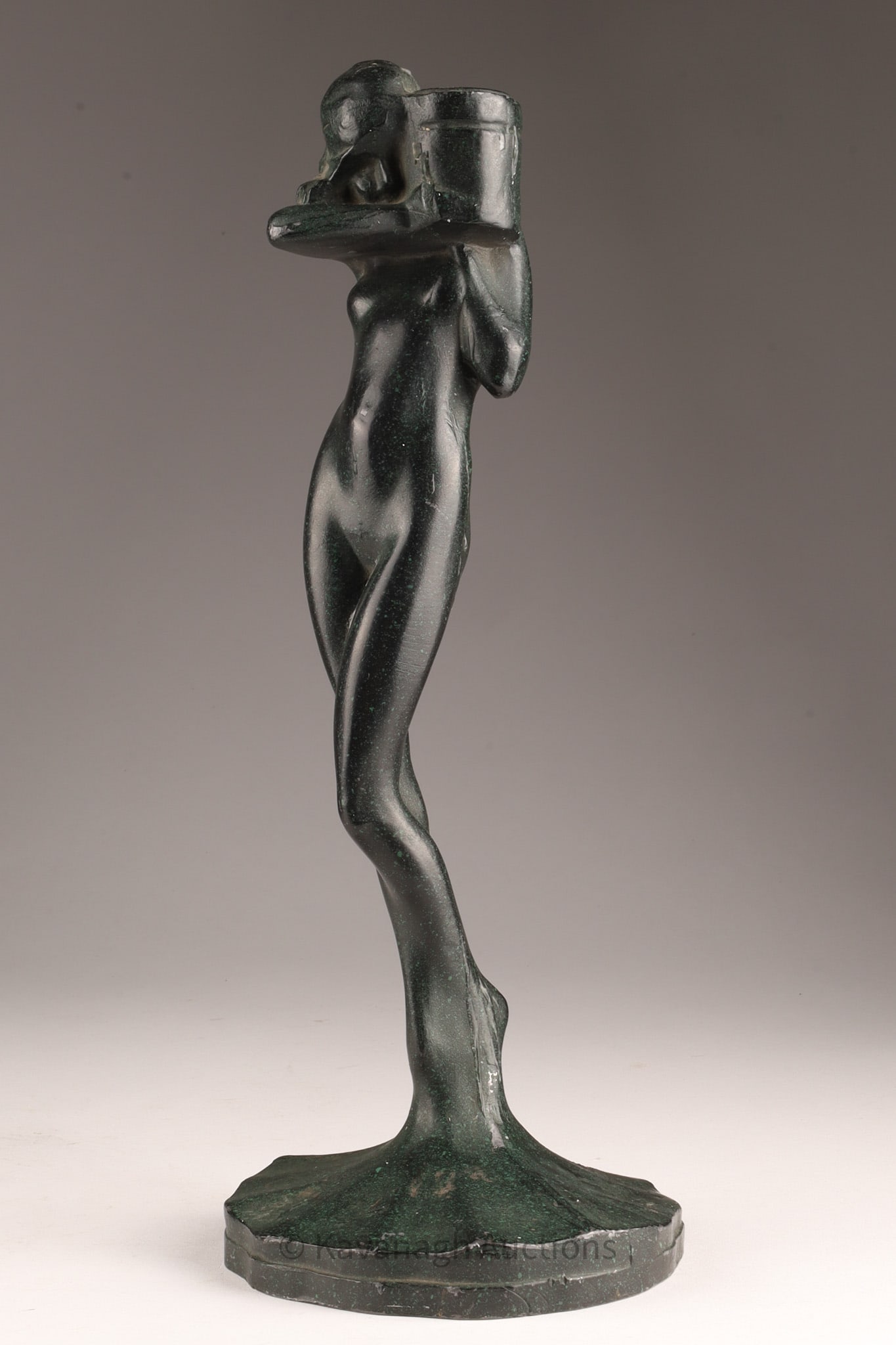C. 1922 Frankart Spelter Nude Woman Candlestick: Arthur von Frankenberg Art Deco Patinated Cast Metal Sculpture of a Woman with Jar, Marked on base, Co 1922. 13 inches H x 4.5 W. Some loss to green patination on base.