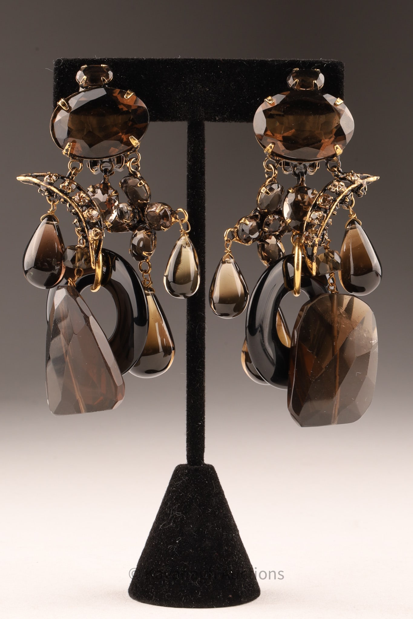 Iradj Moini Smokey Quartz Onyx Chandelier Earrings: Iradj Moini New York pair of chandelier earrings set with facet cut smokey quartz and polished onyx, marked Iradj Moini on clip3 inch drop