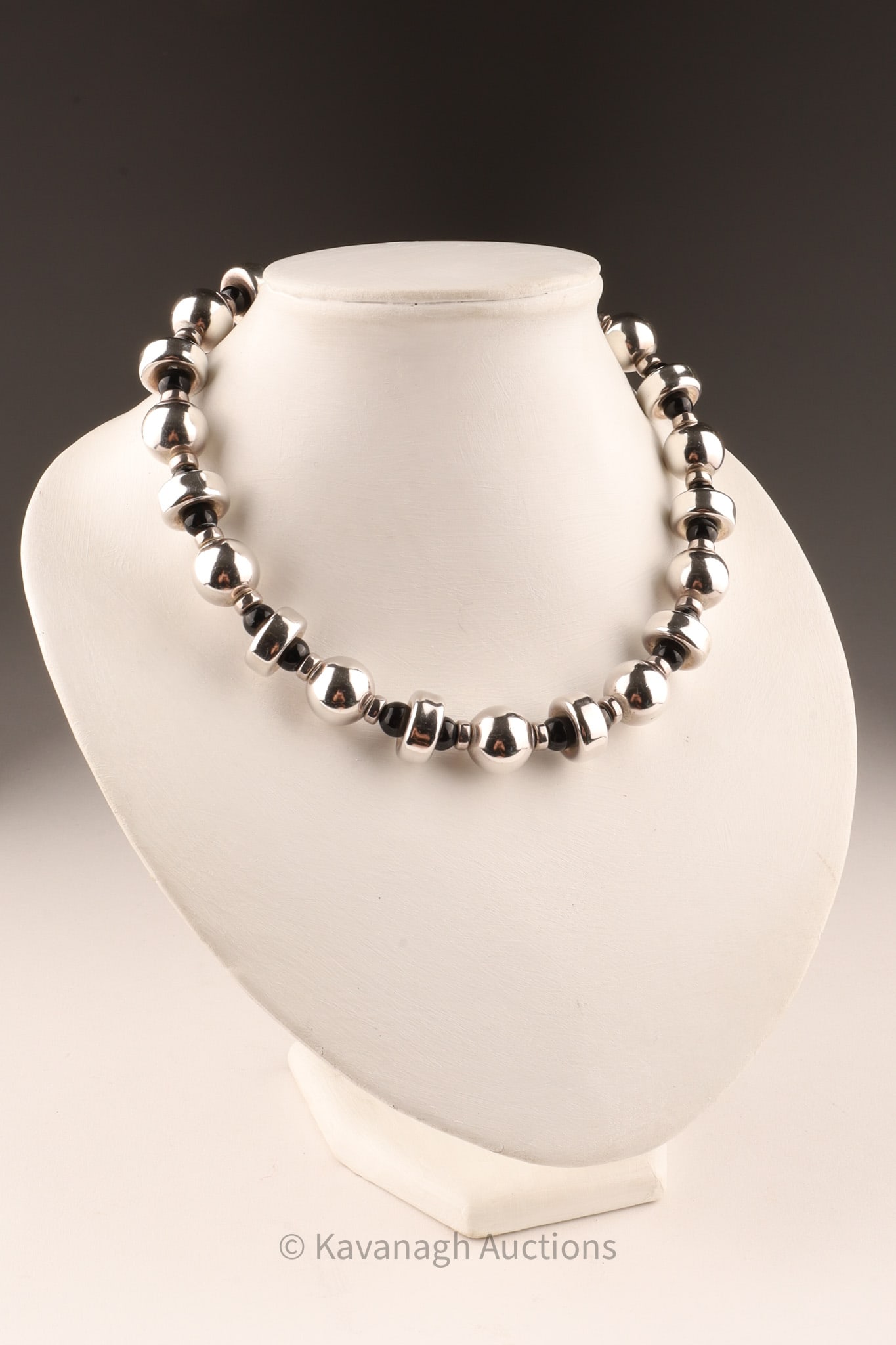 Sterling Silver and Onyx Chunky Necklace: Chunky necklace of sterling silver balls and disks inter-set with onyx beads, sterling is bright and shiny, marked Sterling on claspweight 110 grams, 18 inches L.