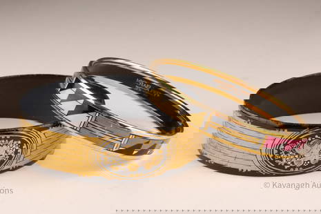 2 Michaela Frey Austria Bangle Bracelets: 2 Michaela Frey Austria Bangle Bracelets. Marked 24ct gold decoration on enamel, base metal steel with 1 micro gold plated brass borderLarger bangle measures 9 inches circumference, smaller measures 8