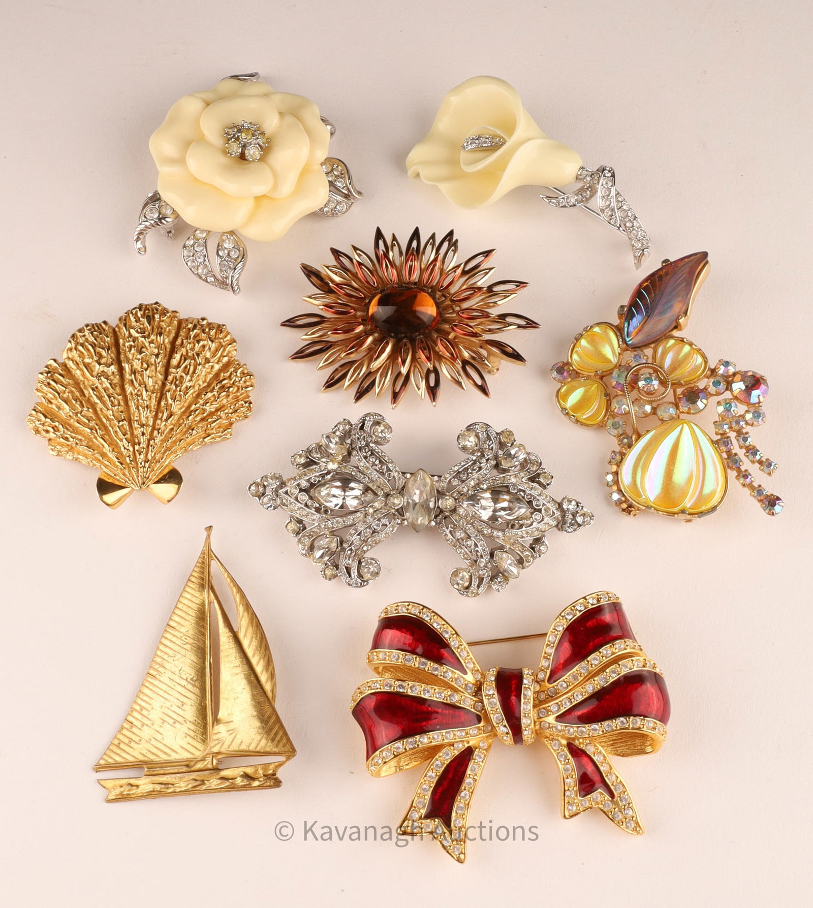 Costume Jewelry Brooch Lot / Nolan Miller, Joan Rivers, Trifari...: Costume Jewelry Brooch Lot / Nolan Miller, Joan Rivers, Trifari, Caro, Miriam Haskell. Gold tone and silver tone brooches set with rhinestones.All approximately 2 - 3 inches W