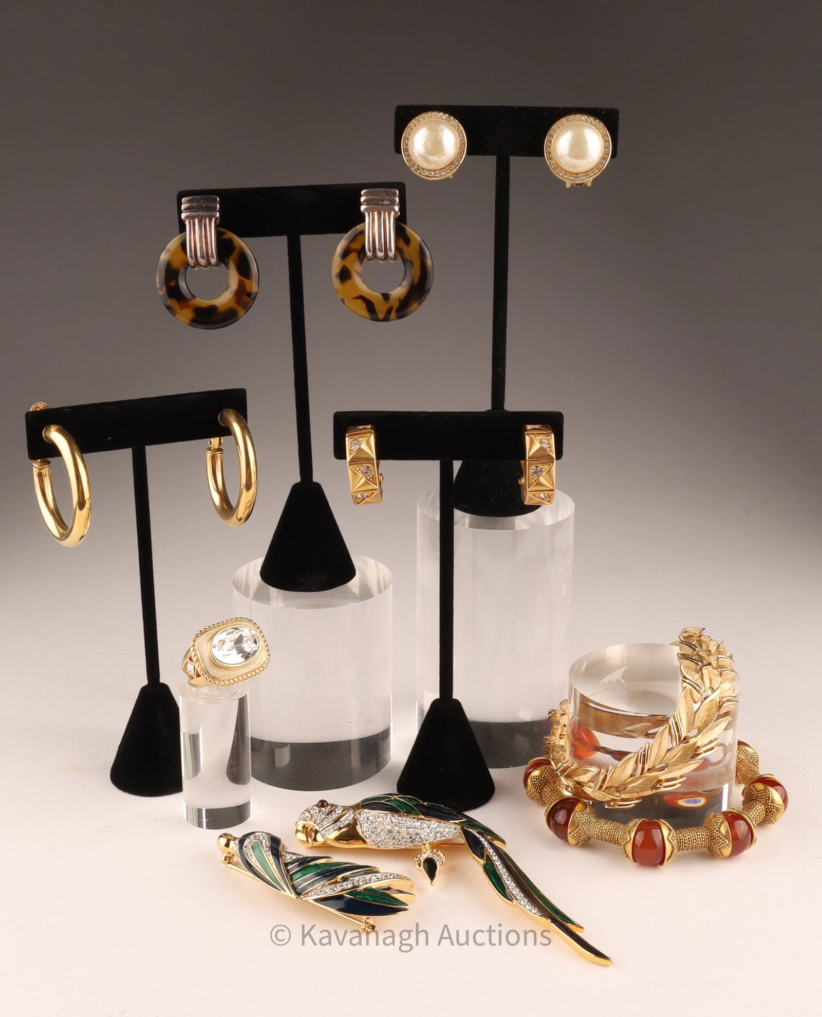 Costume Jewelry Lot / D'Orlan, Trifari, Ralph Lauren...: Costume Jewelry Lot Earrings, Brooches, Bracelets / D'Orlan Parrot Broochs, Trifari bracelet, Ralph Lauren, Christian Dior.Carnelian and gold tone bracelet measures 8 inches, large parrot brooch measu