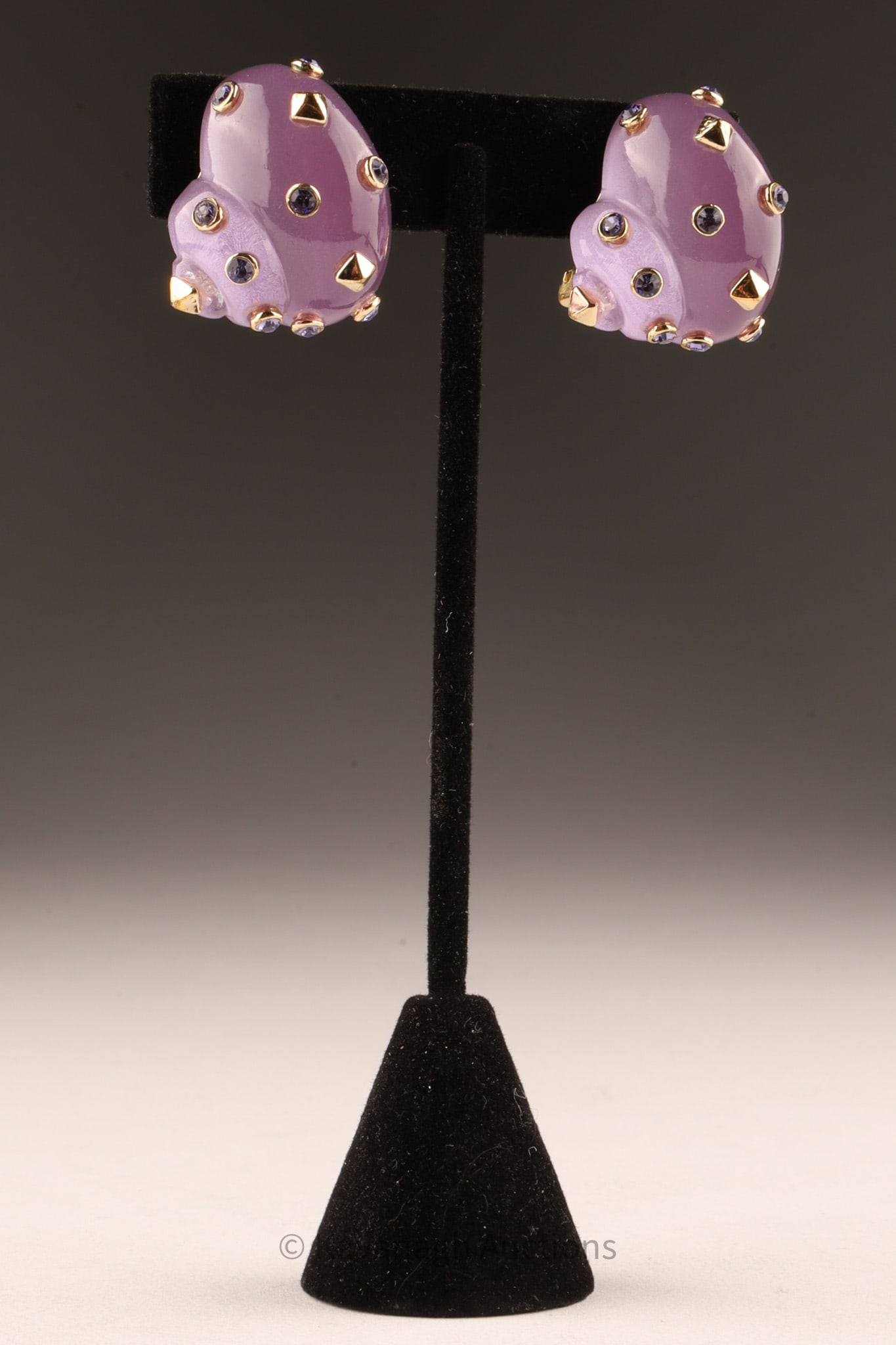 Italian Purple Resin Alexandrite Shell Replica Earrings: Italian pair of clip on earrings in the shape of shells made of lavender violet resin encrusted with alexandrite stones and gold pyramids, marked on back Replica Made in Italy1 inch W.
