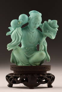 Chinese Antique Carved Turquoise Stone Guanyin: Chinese antique hand carved figure of a sitting Guanyin in true turquoise stone, set on small carved wood base.Seated figure measures 2.25 inches H x 2 W, 3 inches H on stand.