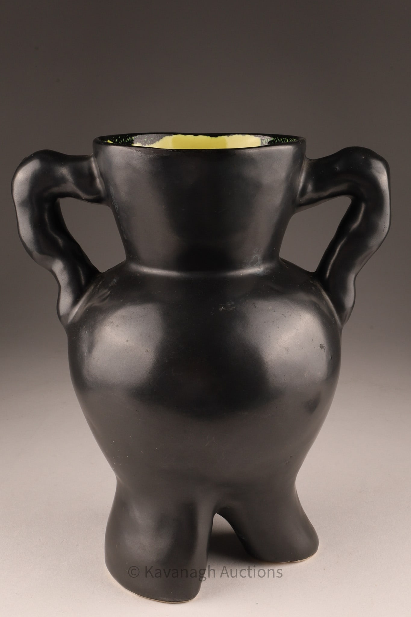 Pol Chambost Style Ceramic Vase: Glazed earthenware, black lustre exterior with glossy chartreuse yellow interior, three-legged vessel with double loop handles and a bulbous, anthropomorphic body. Though unsigned, the design recalls