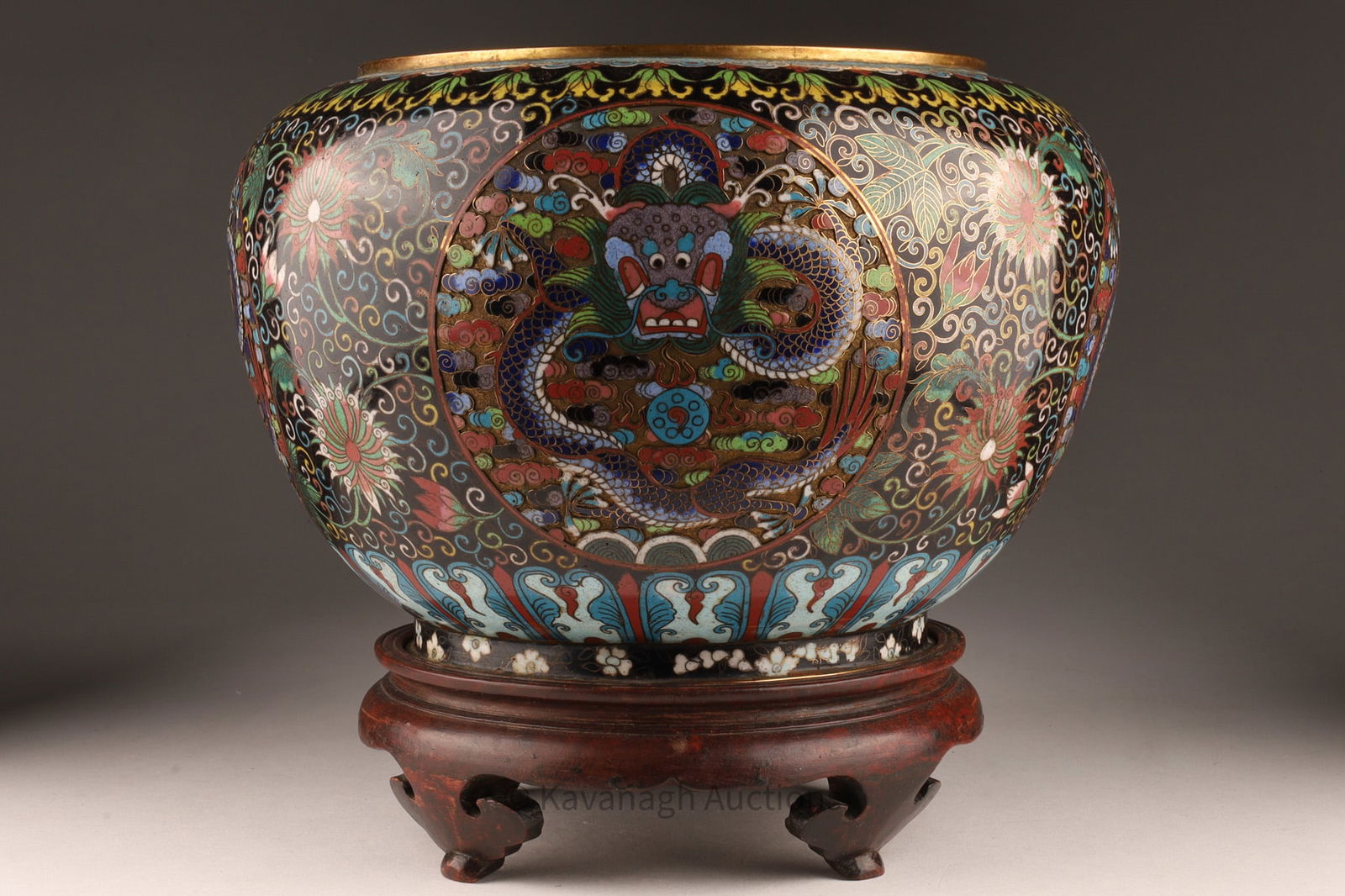 Antique Chinese or Japanese Cloisonne Jardiniere Dragons: Antique Chinese or Japanese Cloisonne Jardiniere, of tapered oviform body decorated with dragons in medallions on black ground. Turned wood stand. Pot measures 7 inches H x 9 W, with stand measures 9