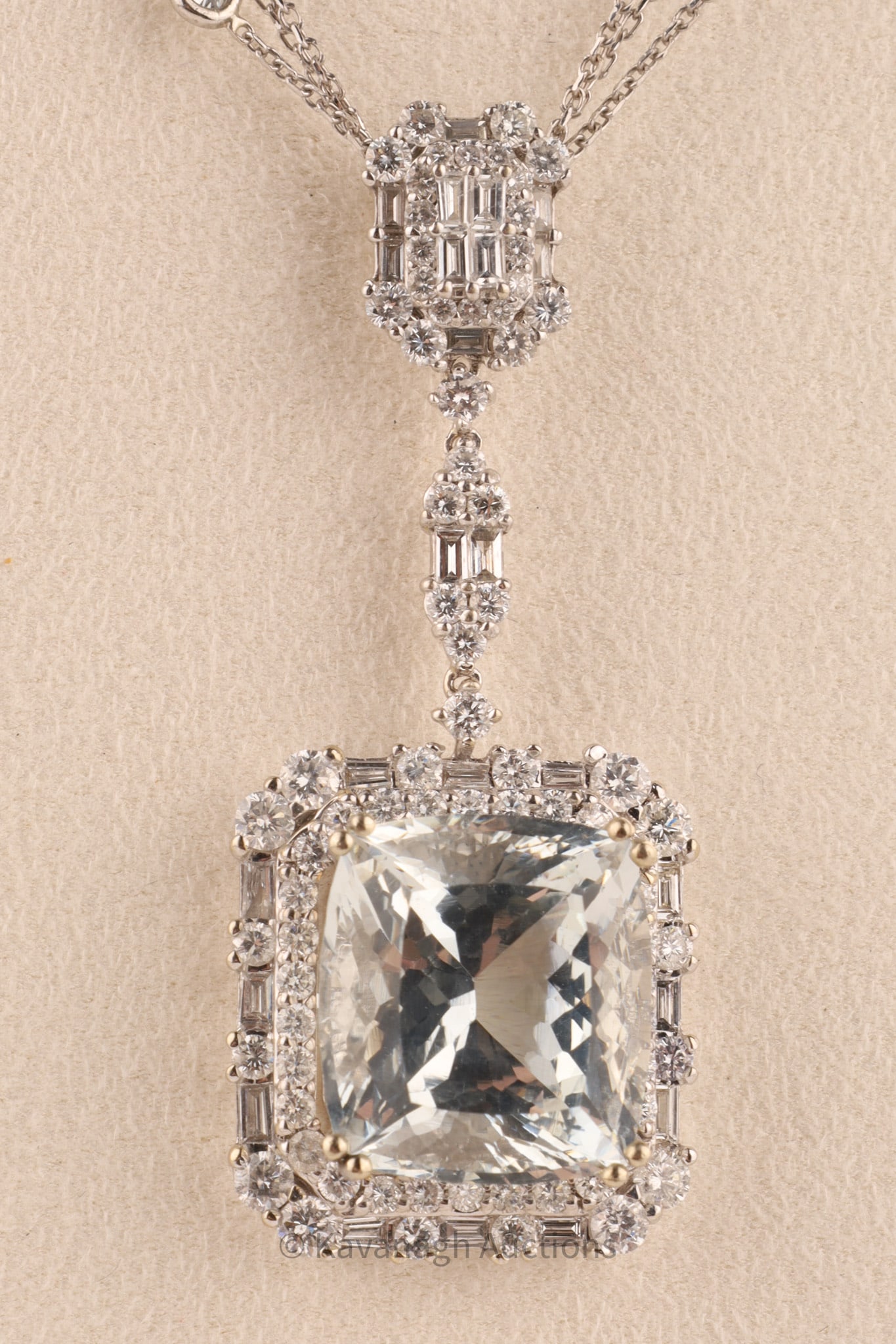 18kt Gold Aquamarine and Diamond Necklace in De Grisogono case: 18kt Gold Aquamarine and Diamond Pendant Necklace — 3.10 cts Total Diamonds. An elegant and finely crafted 18kt yellow gold designer pendant, centering a vivid cushion-cut natural aquamarine weighin