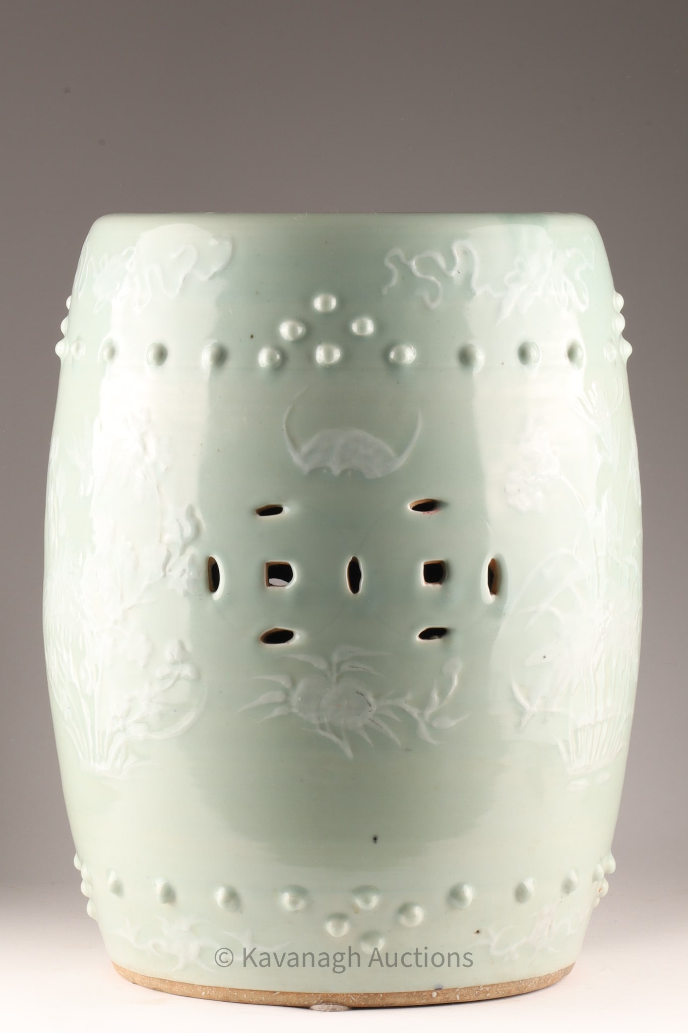 Chinese Celadon Garden Stool: Chinese Celadon Garden Stool with raised decoration. Measuring 19 inches H x 12 W. 