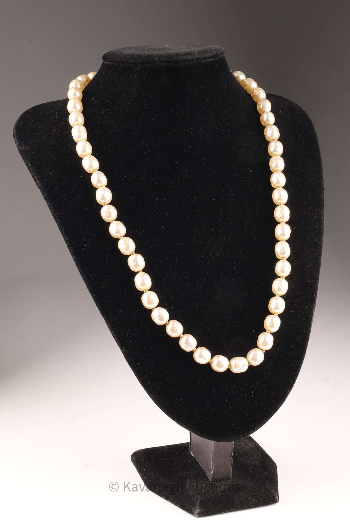 Signed MIRIAM HASKELL Faux Baroque Pearl Necklace: Signed MIRIAM HASKELL Faux Baroque Pearl Necklace with faceted metal bead spacers. Measuring 24 inches L.
