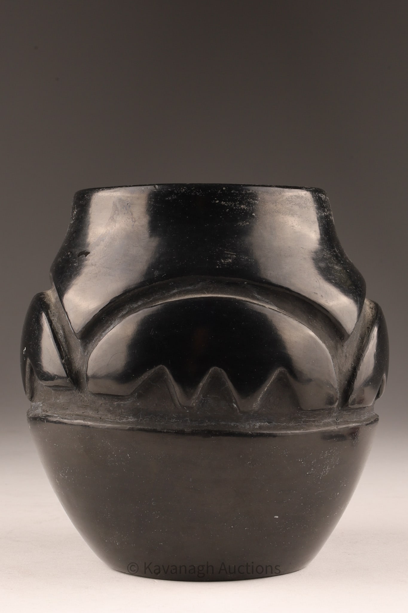 Southwest American Black Pottery Vase Signed Virginia: Southwest American Black Pottery Vase Signed Virginia with carved geometric patter around the waist of the vase. Measuring 5 inches H x 5 W. Signed on underside. 