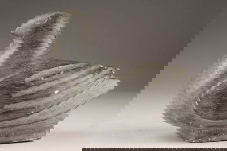 Inuit, 20th century Stone Carving of a Bird: Steatite carving of a stylized bird with incised eyes and wings, resting form with squared base. Subtle detailing to the feathers enhances its simplified shape. Height 3.5 in, 9 cm; Length 4 in,