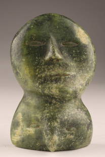 Inuit Carved Green Soapstone Sculpture of Two Heads: Inuit green soapstone / Serpentine face carved from Nunavut depicting a human head over a bird head. Approx. 4 inches in height.