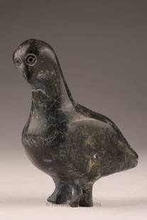 Paulassie Tungilik (1947 - 2014, Pelly Bay) Stone Bird Carving with Original Tag: Carved stone bird, likely a loon, executed in a compact and stylized form with incised circular eyes and rounded body. Retains original Government of Canada Eskimo Art igloo tag and handwritten
