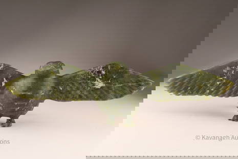 Large Inuit Stone Bird Sculpture, Thadlik Nung (Cape Dorset), 1984: A striking hand-carved Inuit stone sculpture of a bird with outstretched wings, carved in deep green stone with natural inclusions. The bird's stylized form emphasizes broad wingspan and rounded