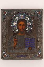 Antique Russian Gilt Silver Mounted Icon of Christ the Pantocrator: The silver gilt oklad with cloisonne halo and applied decorations on corners and sides of frame. Marked on front in Cyrillic and kokoshnik for Moscow, 1893 on underside of frame. Measuring 12.5”
