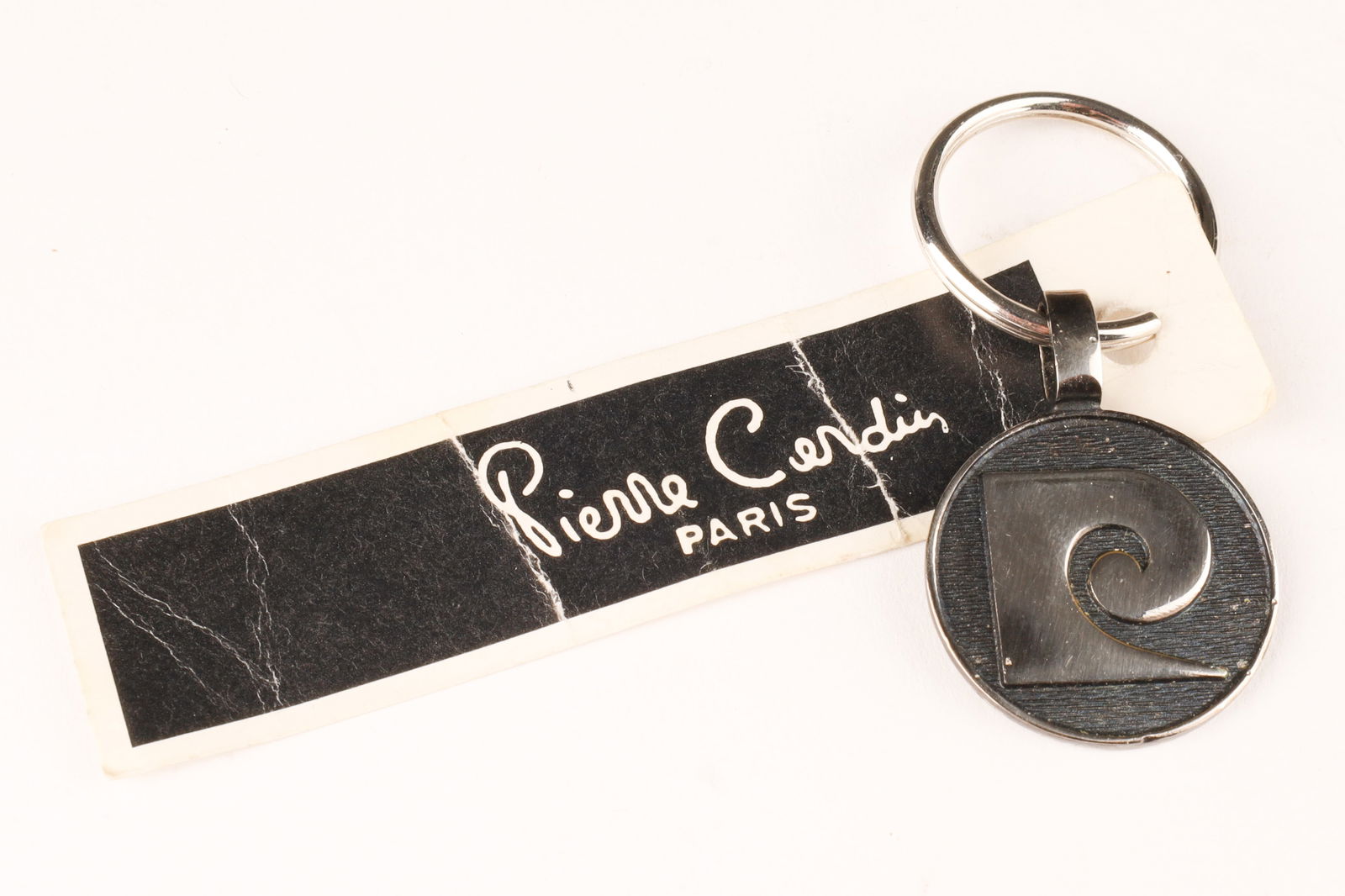 Vintage Pierre Cardin Keychain with Original Tag: Vintage Pierre Cardin Keychain with Original Tag. 2.25” x 1”