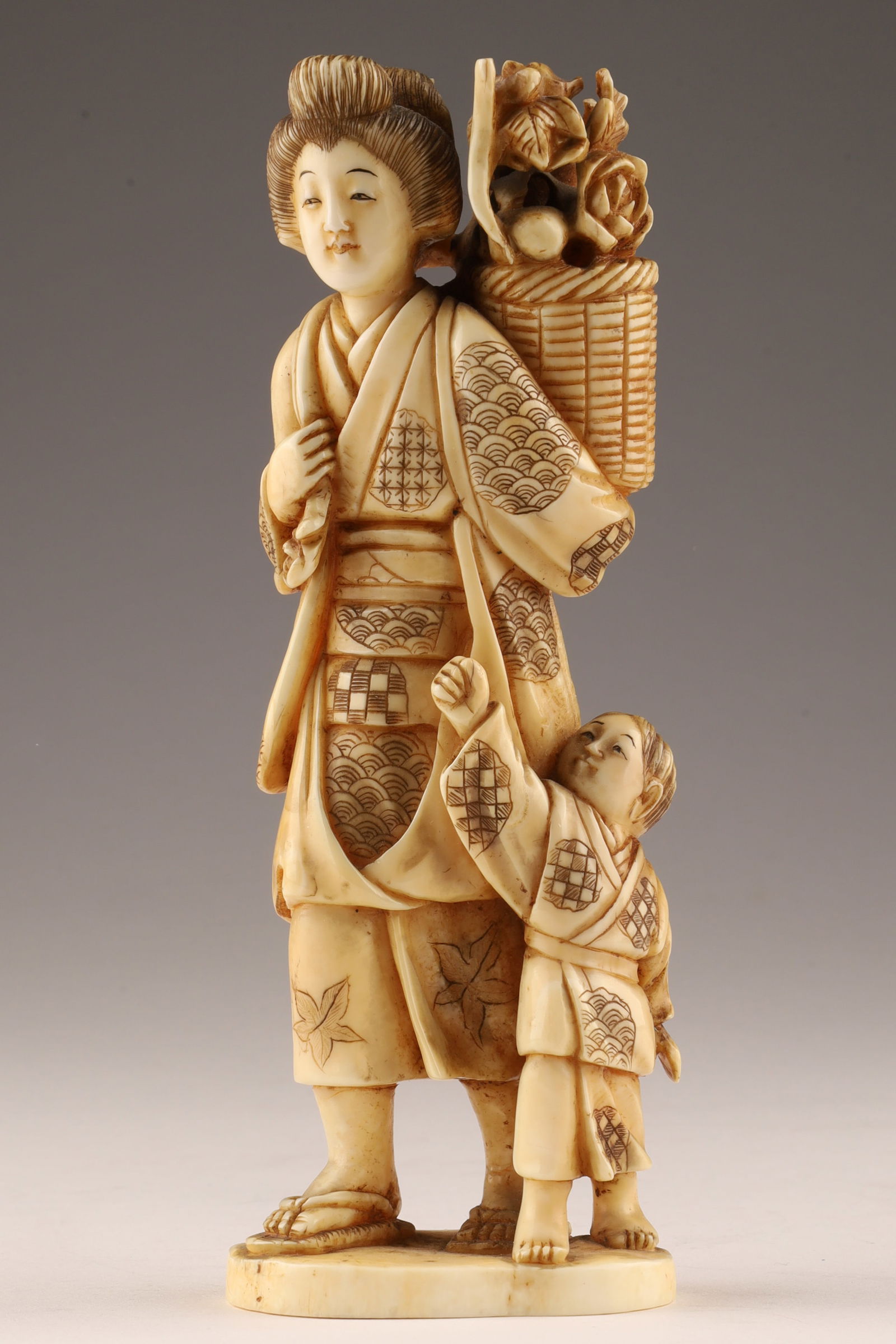 Antique Japanese Okimono Signed Figure, Woman Farmer with Child: Antique Japanese Okimono Signed Statue, Figure of a Woman Farmer with Child. Signed with a feather on the base. THIS ITEM CANNOT BE EXPORTED FROM CANADA. Measuring 5.75 inchesH.
