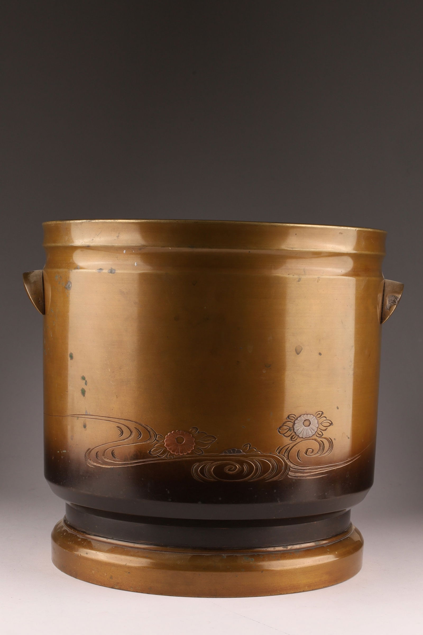 Large Japanese Bronze and Mixed Metals Jardiniere Planter: Large Japanese Bronze and Mixed Metals Jardiniere Planter, decorated with whorls and flowers. Measuring 9.5 inches H x 10 W.