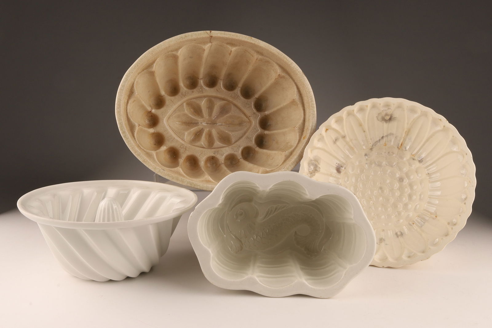 Collection of Antique Ceramic Jelly Moulds: Collection of Antique Ceramic Jelly Moulds, Copeland and others. Largest mould has a hairline, measures 4.5 inches H x 9 W x 7 deep. 