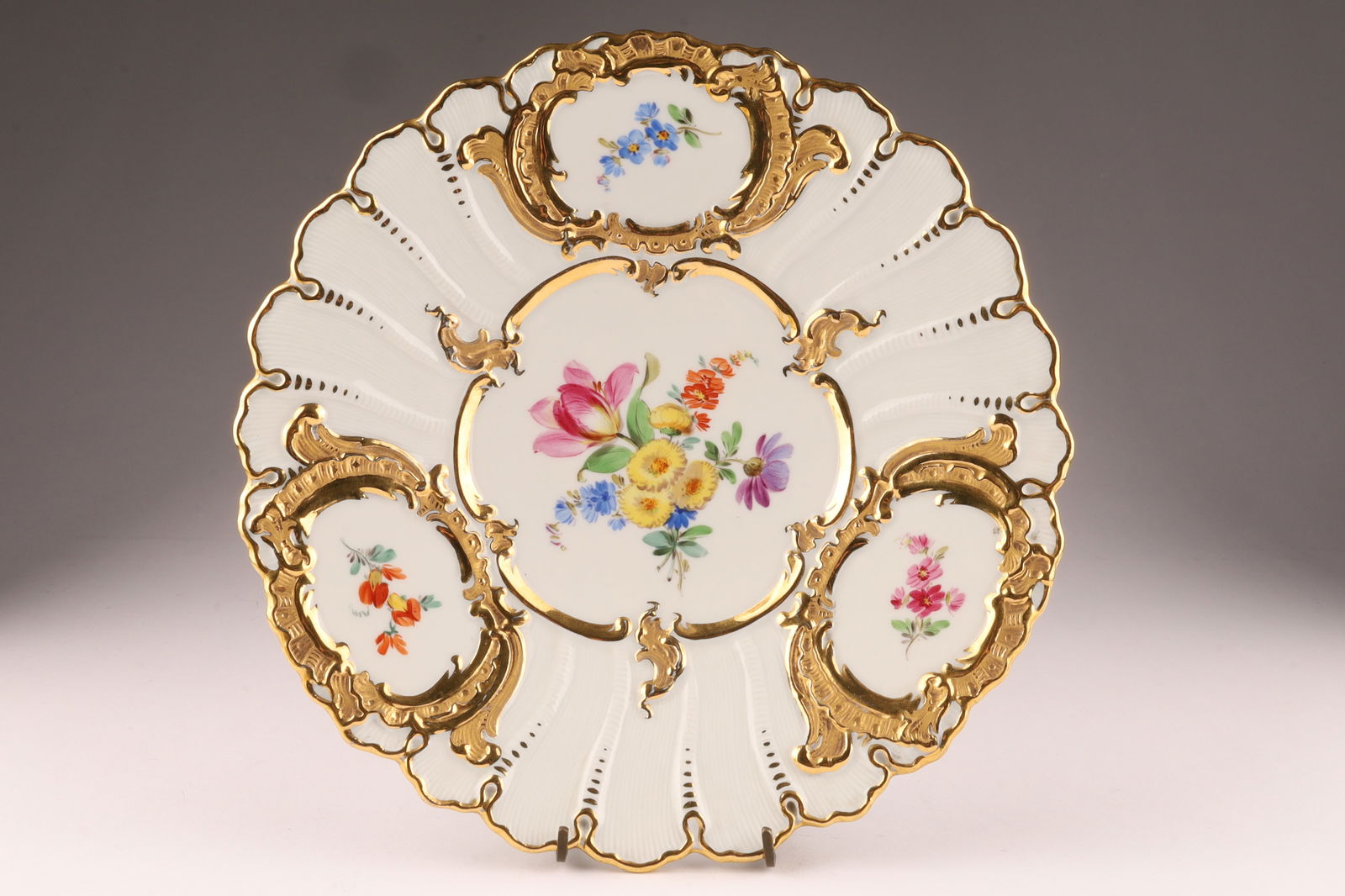 Antique Germany Meissen Floral and Gilt Decorated Porcelain Charger: Antique Germany Meissen Floral and Gilt Decorated Charger, measuring 9.25 inches diameter, with blue underglaze mark.